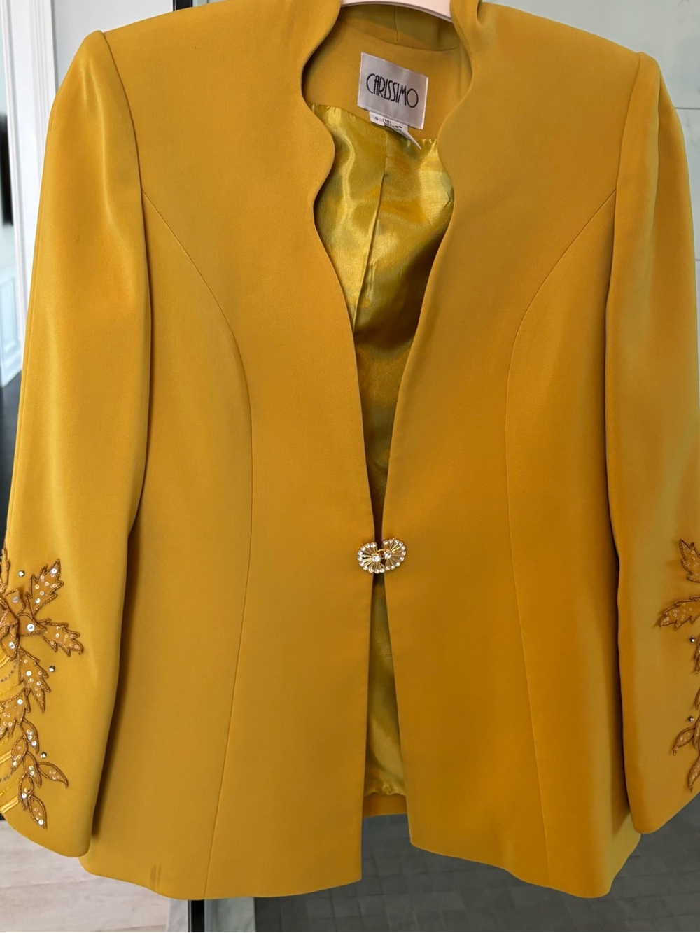 Beautiful embellished blazer with crystal closure and detailed sleeves